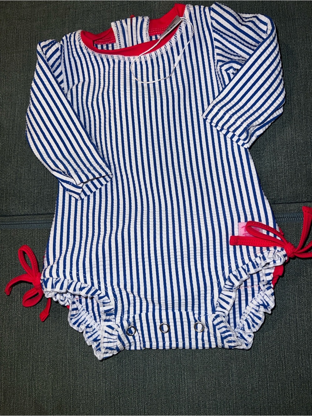 Ruffle Butts Navy and White Striped One-Piece with Red Trim